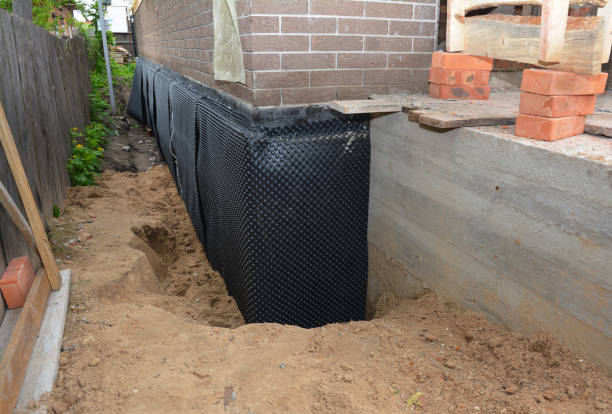 Happy homeowners after waterproofing job in Sturgis
